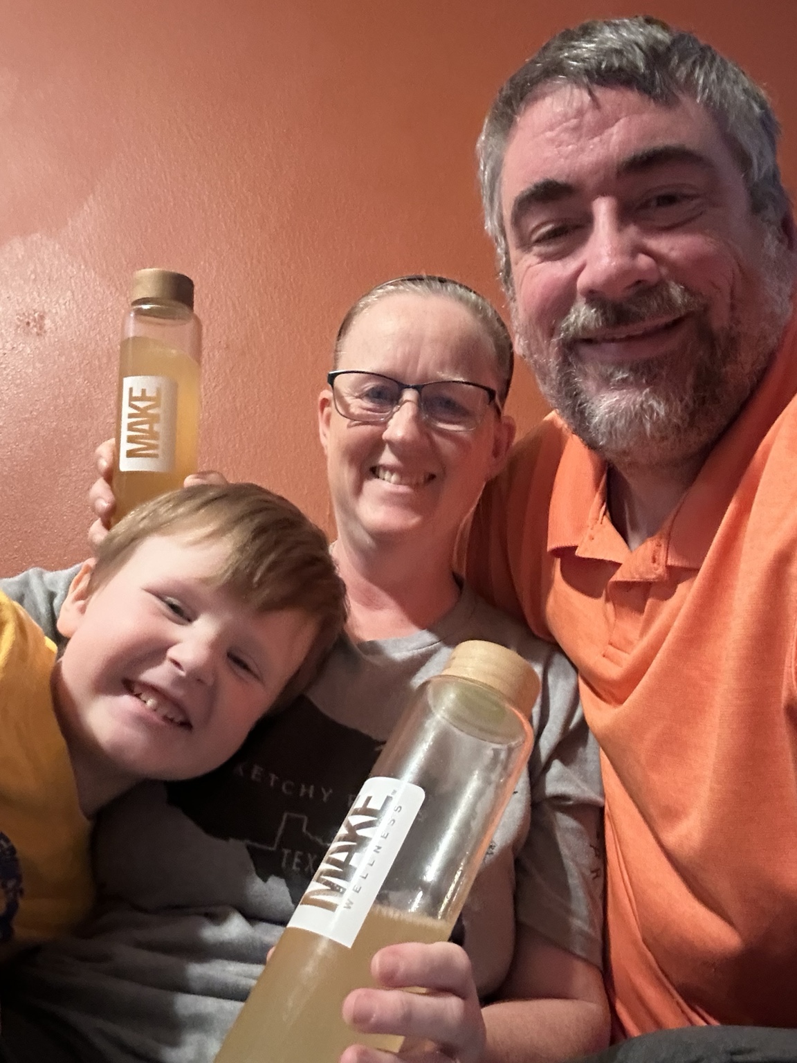 Wade, Laura and Wyatt together with MAKE Wellness bottles